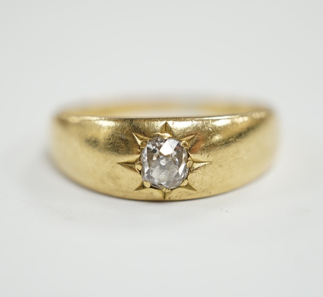 An 18ct gold and gypsy set solitaire diamond ring, size P/Q, gross weight 5 grams.